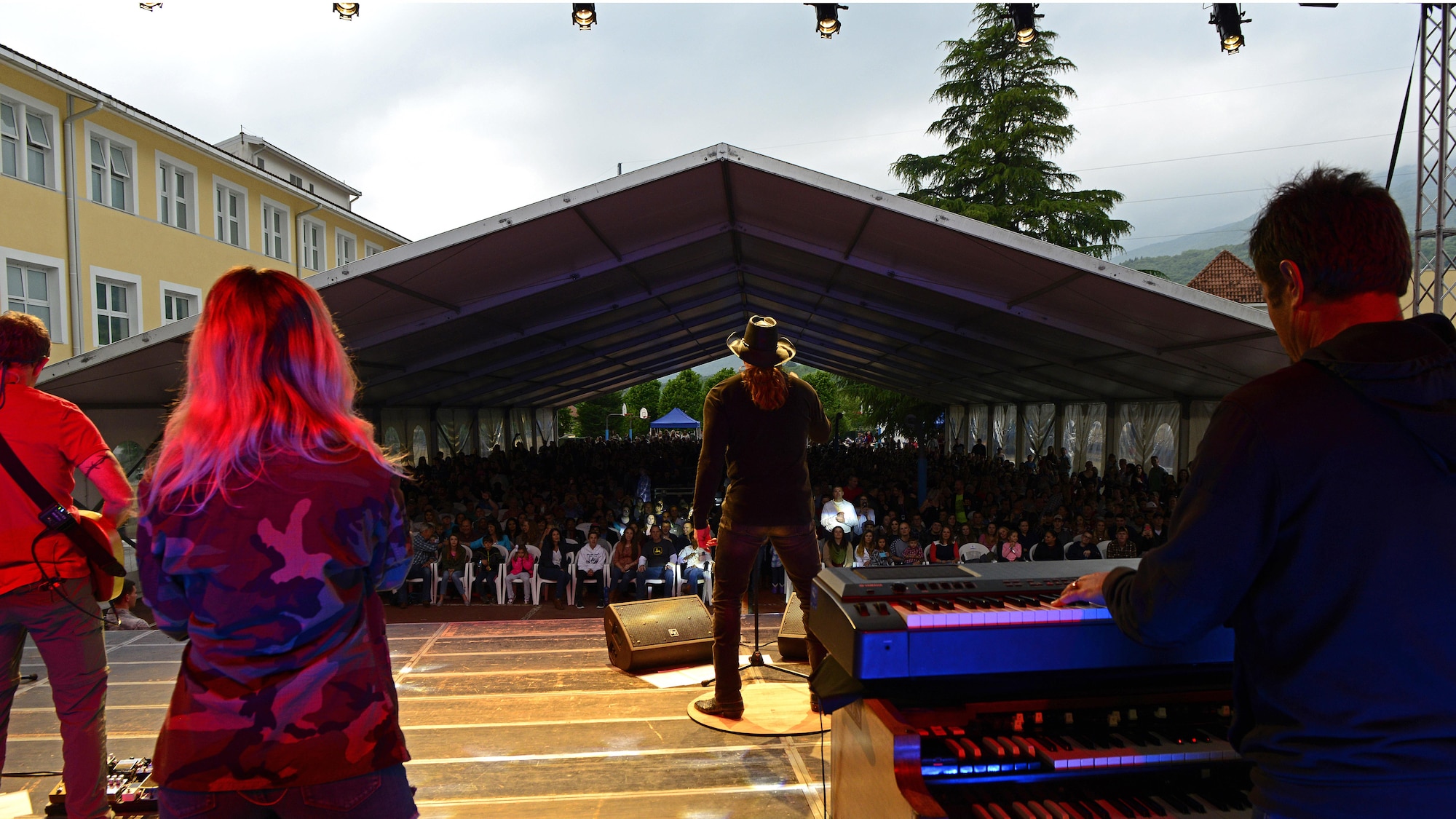 Trace Adkins, Grammy Award–nominated country music singer, performs for a crowd of Airmen and their families at Aviano Air Base, Italy, May 12, 2017.  The performance is part of his 12th USO tour. (Photo by U.S. Air Force Airman 1st Class Ryan Brooks)