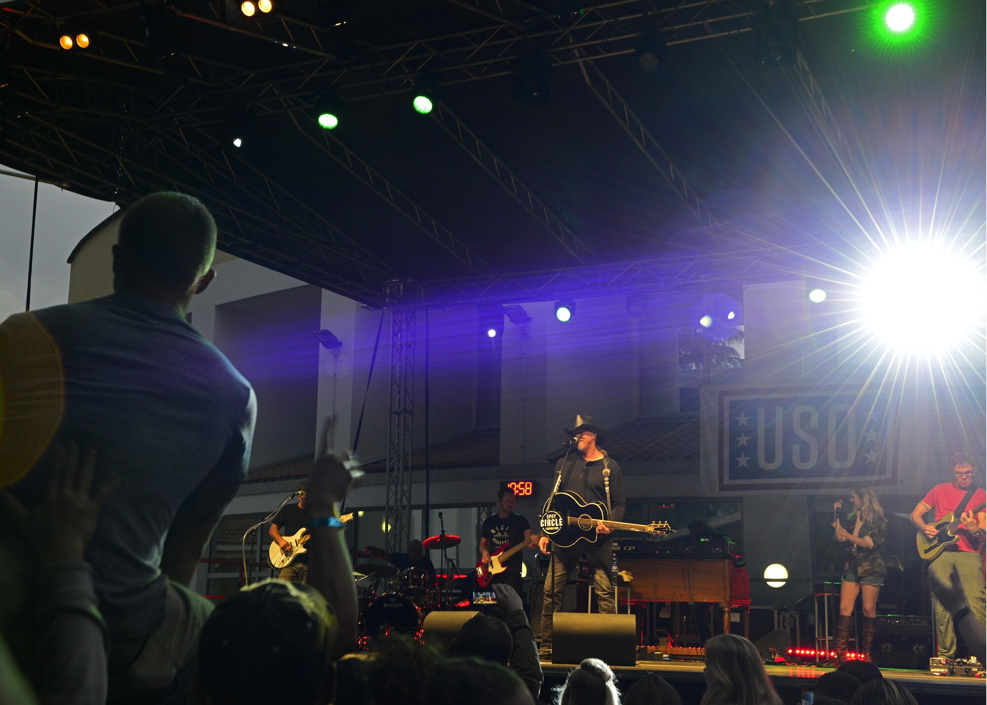 Grammy Award–nominated country music singer, Trace Adkins, belts out a tune during his performance for 1,200 Airmen and family members at Aviano Air Base, Italy, May 12, 2017. Fans crowded below the stage as they sang along with their favorite songs. (Photo by U.S. Air Force Airman 1st Class Ryan Brooks)