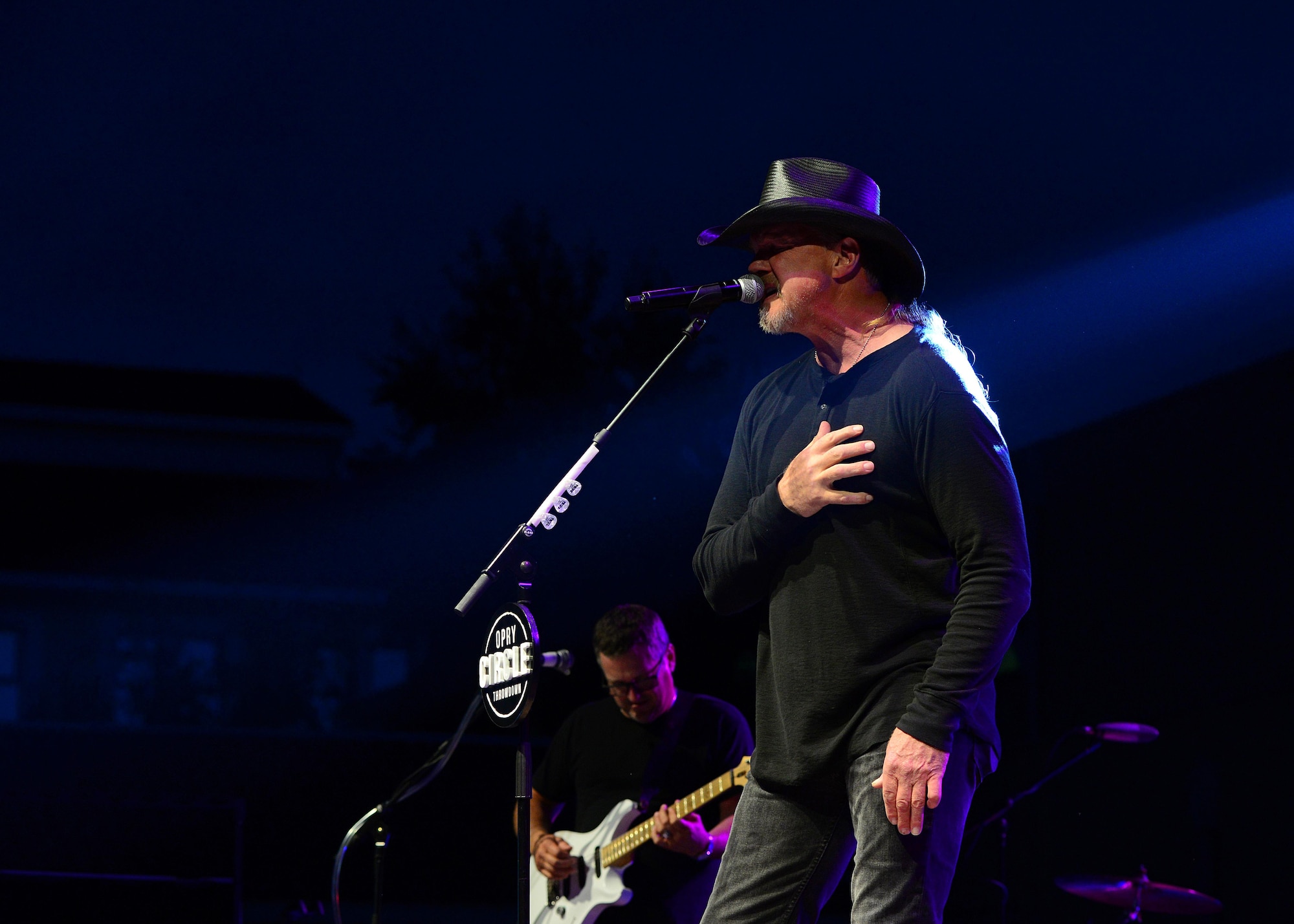 Trace Adkins, Grammy Award–nominated country music singer, performs for a crowd of Airmen and their families at Aviano Air Base, Italy, May 12, 2017.  The performance is part of his 12th USO tour. (Photo by U.S. Air Force Airman 1st Class Ryan Brooks)