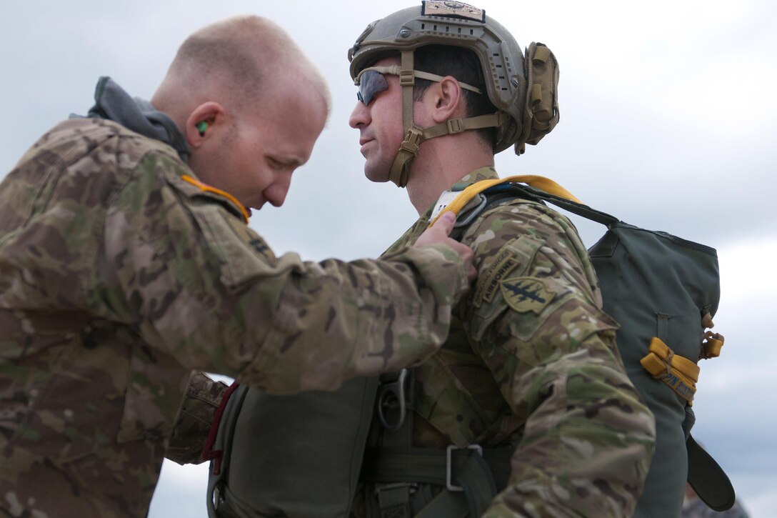 West Virginia Army National Guard Staff Sgt. Matthew Thomas, left, performs a parachute inspection for West Virginia Army National Guard Capt. Anthony Menas before participating in a static line jump from a C-130 Hercules aircraft during the Wings Over Pittsburgh Open House, Pa., May 13, 2017. Thomas and Menas are assigned to the West Virginia Army National Guard's 2nd Battalion, 19th Special Forces Group. Army photo by Staff Sgt. Shaiyla Hakeem