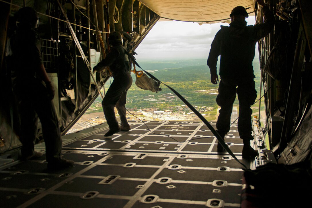 Air Force loadmasters pull in deployment bags into a C-130 Hercules aircraft after a static line jump during the Wings Over Pittsburgh Open House, Pa., May 13, 2017. Army photo by Staff Sgt. Shaiyla Hakeem