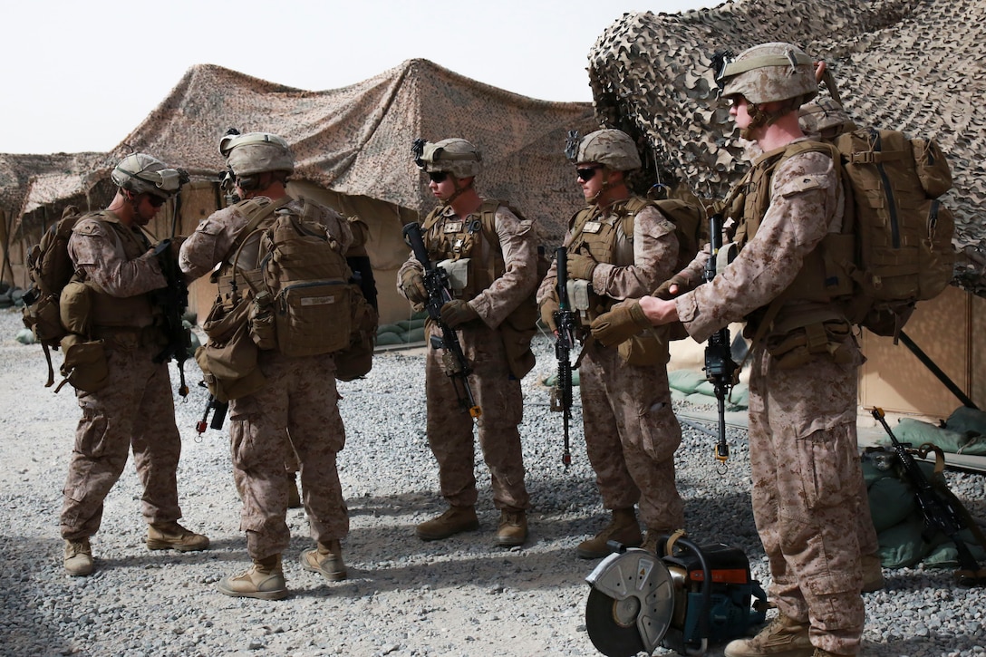 U.S. Marines with 1st Battalion, 7th Marine Regiment, Special Purpose Marine Air-Ground Task Force-Crisis Response-Central Command, prepare to load an MV-22 Osprey tiltrotor aircraft assigned to Marine Medium Tiltrotor Squadron 364 to conduct a tactical recovery of aircraft and personnel exercise in Jordan, May 8 2017. This event supported Eager Lion 2017, a recurring multinational exercise designed to strengthen military-to-military relationships, increase interoperability between partner nations, and enhance regional security and stability. The SPMAGTF is a self-sustaining expeditionary unit, designed to provide a broad range of crisis response capabilities throughout the Central Command area of responsibility, using organic aviation, logistical, and ground combat assets. (U.S. Marine Corps photo by Cpl. Christopher Thompson)
