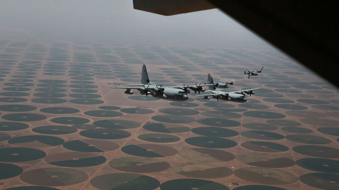 A division of U.S. Marine Corps KC-130J Super Hercules assigned to Marine Aerial Refueler Transport Squadron and an MV-22 Osprey tiltrotor aircraft with Marine Medium Tiltrotor Squadron 364, Special Purpose Marine Air-Ground Task Force-Crisis Response-Central Command, return from a tactical recovery of aircraft and personnel exercise in Jordan, May 8 2017. This event supported Eager Lion 2017, a recurring multinational exercise designed to strengthen military-to-military relationships, increase interoperability between partner nations, and enhance regional security and stability. The SPMAGTF is a self-sustaining expeditionary unit, designed to provide a broad range of crisis response capabilities throughout the Central Command area of responsibility, using organic aviation, logistical, and ground combat assets. (U.S. Marine Corps photo by Cpl. Christopher Thompson)