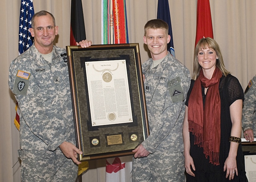 Army Maj. Andrew “Drew” Johannes, from Stillwater, Okla., is a 2017 recipient of the Federal Engineer of the Year Award, an annual award honoring the top engineers employed by federal agencies across the country. He currently serves as the battalion executive officer of the 84th Engineer Battalion, 130th Engineer Brigade, 8th Theater Sustainment Command at Schofield Barracks, Hawaii. Then-Capt. Johannes with wife, Cassie, is shown here receiving the General Douglas MacArthur Leadership Award from then-Army Brig.Gen. Robert B. Brown on Feb. 24, 2009, while he served as the commander of Headquarters and Headquarters Company, 1st Battalion, 4th Infantry Regiment in Hohenfels, Germany. Courtesy photo