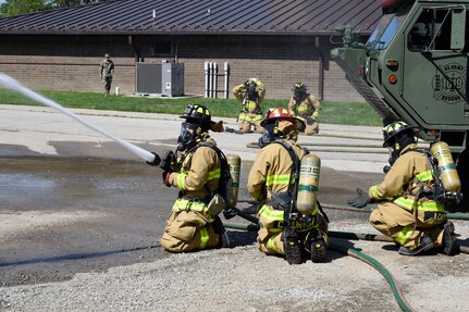 Indiana National Guard firefighters with the 719th Engineer Firefighter Detachment Headquarters perform an equipment test while practicing their firefighting skills at Muscatatuck Urban Training Center, May 13. (U.S. Army Reserve photo by Sgt. Clinton Massey, 206th Broadcast Operations Detachment)