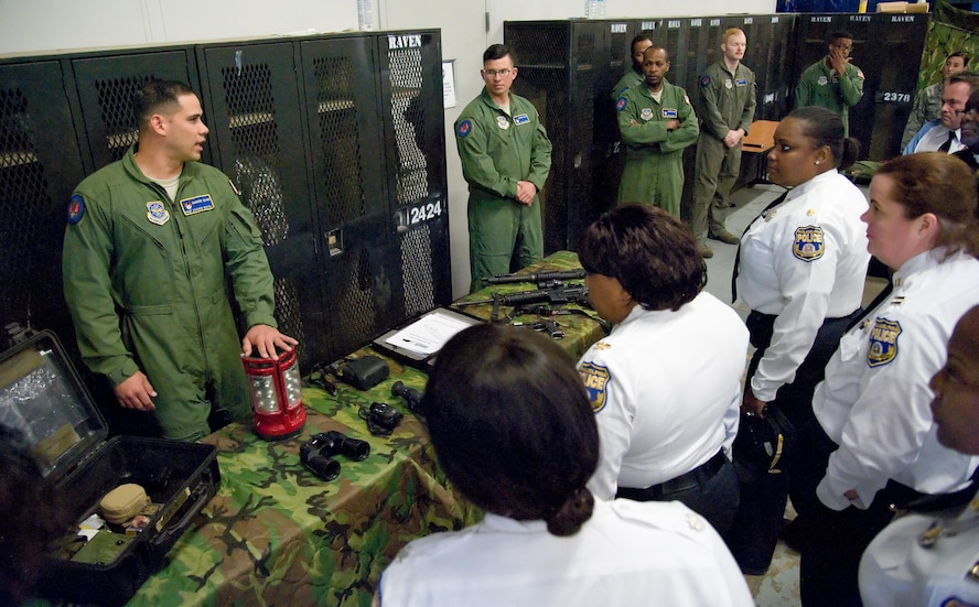 Staff Sgt. Steven Tayfel, a 436th Security Forces Squadron Raven, answers questions from members of the Philadelphia Police Department, Philadelphia, Pa., May 11, 2017, at Dover Air Force Base, Del. Tayfel and other Ravens talked about training requirements and equipment used by Ravens during off-station deployments. (U.S. Air Force photo by Roland Balik)