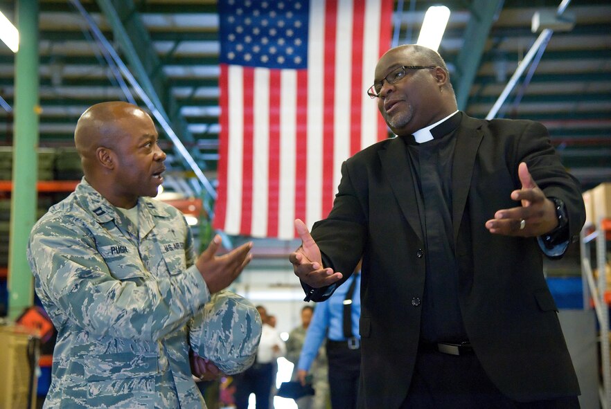 Chaplain (Capt.) Kevin Pugh, 436th Airlift Wing, talks with Reverend Darryl Scott, Philadelphia Police Department Police Clergy, Philadelphia, Pa., while visiting the 436th Security Forces Squadron Ravens section May 11, 2017, at Dover Air Force Base, Del. Fifteen members of the police department toured different sections of the 436th SFS during their five-hour visit to the base. (U.S. Air Force photo by Roland Balik)