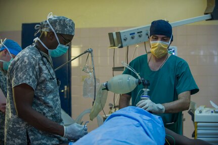 U.S. Army Reserve Maj. Christopher Sims, a nurse anesthetist, and his counterpart monitor a patient prior to a thyroidectomy at Medical Readiness Training Exercise 17-3 at the Military Teaching Hospital in N'Djamena, Chad, May 15. The mutually beneficial exercise offers opportunities for the partnered militaries to share best practices and improve medical treatment processes. (U.S. Army Africa photo by Staff Sgt. Shejal Pulivarti)