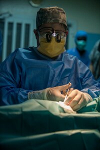 U.S. Army Reserve Col. Peter Ray, a plastic surgeon, removes a cyst on a surgical patient during Medical Readiness Training Exercise 17-3 at the Military Teaching Hospital in N'Djamena, Chad, May 15. The mutually beneficial exercise offers opportunities for the partnered militaries to share best practices and improve medical treatment processes. (U.S. Army Africa photo by Staff Sgt. Shejal Pulivarti)