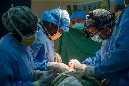 Chadian Col. Bakhit Saleh Harane, surgeon, and U.S. Army Reserve Col. Christopher Sinha, an ear, nose and throat surgeon perform a thyroidectomy during Medical Readiness Training Exercise 17-3 at the Military Teaching Hospital in N'Djamena, Chad, May 15. The mutually beneficial exercise offers opportunities for the partnered militaries to share best practices and improve medical treatment processes. (U.S. Army Africa photo by Staff Sgt. Shejal Pulivarti)