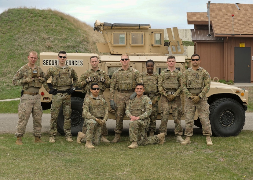 The 91st Security Forces Group Global Strike Challenge team poses for a group photo at Minot Air Force Base, N.D., May 1, 2017. The team trained in preparation for the upcoming competition, which challenges physical fitness, security forces tactics, job knowledge and weapons firing. (U.S. Air Force photo/Airman 1st Class Jessica Weissman)