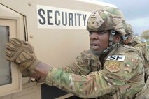 Airman 1st Class Rosa Young, 891st Missile Security Forces Squadron response force member, pushes a Humvee at Minot Air Force Base, N.D., May 1, 2017. The 91st Security Forces Group Global Strike Challenge team trained for the upcoming competition for over a month. (U.S. Air Force photo/Airman 1st Class Jessica Weissman)