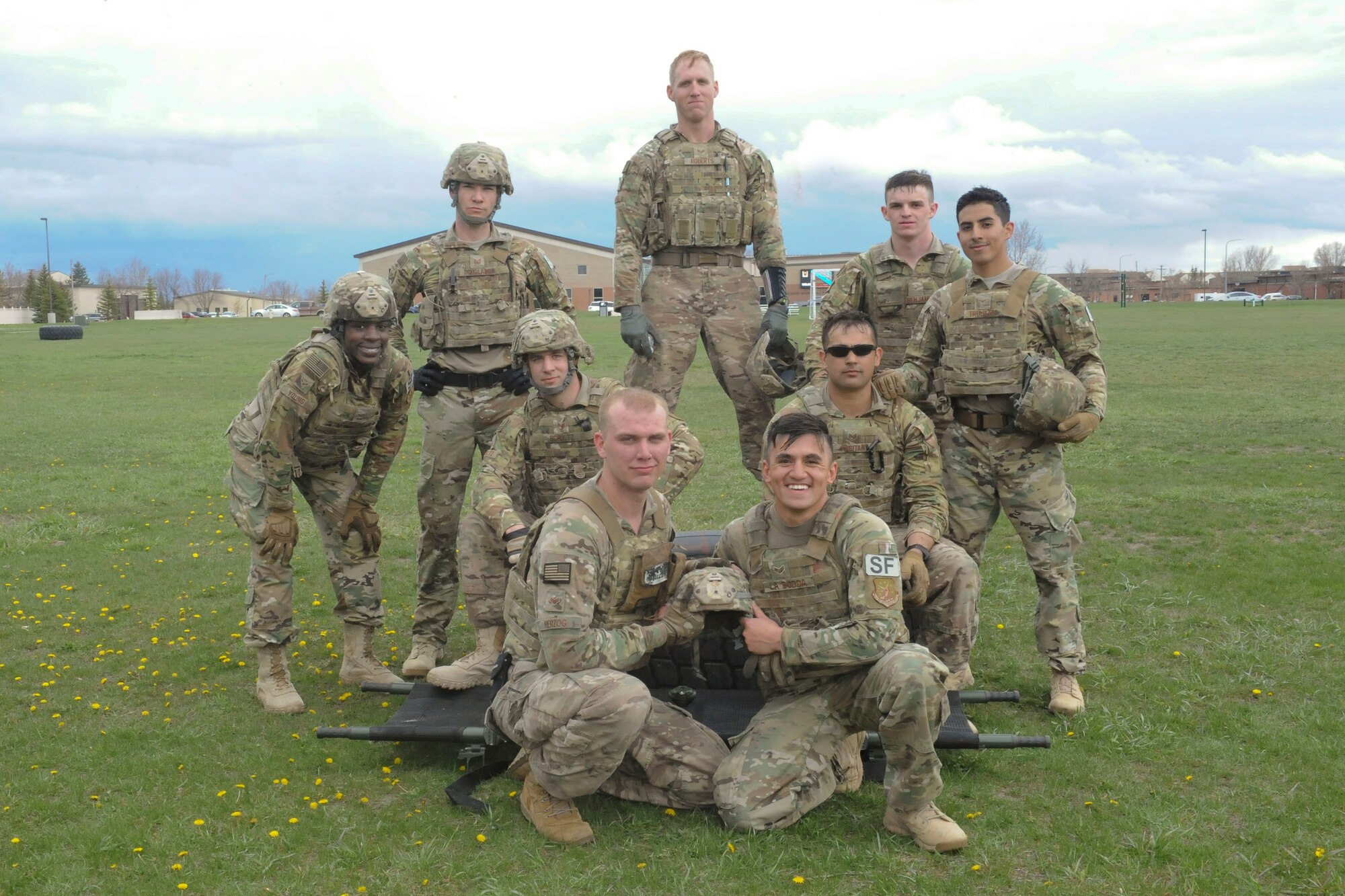 The 91st Security Forces Group Global Strike Challenge team poses for a group photo at Minot Air Force Base, N.D., May 1, 2017. The team trained in preparation for the upcoming competition, which challenges physical fitness, security forces tactics, job knowledge and weapons firing. (U.S. Air Force photo/Airman 1st Class Jessica Weissman)