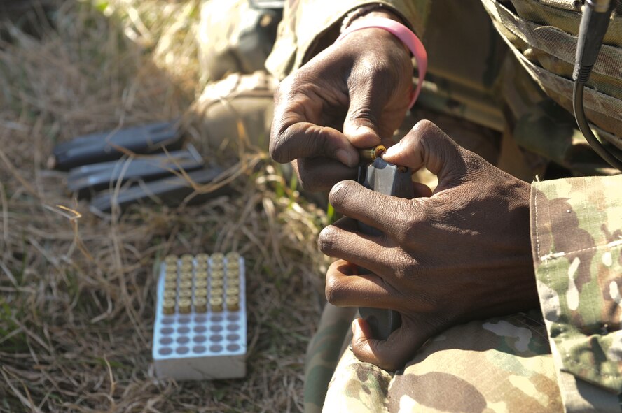 A member of the 91st Security Forces Group Global Strike Challenge team loads a magazine at Camp Grafton South, Devil’s Lake, N.D., May 4, 2017. The 91st Security Forces Group Global Strike Challenge team trained in preparation for the upcoming competition, which challenges security forces tactics, job knowledge and weapons firing. (U.S. Air Force photo/Airman 1st Class Jessica Weissman)