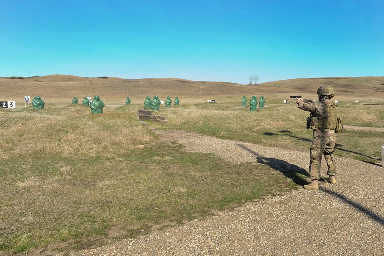 1st Lt. Ariana Maldonado, 91st Security Forces Group executive officer, fires an M9 pistol at Camp Grafton South, Devil’s Lake, N.D., May 4, 2017. The 91st Security Forces Group Global Strike Challenge team trained in preparation for the upcoming competition, which challenges security forces tactics, job knowledge and weapons firing. (U.S. Air Force photo/Airman 1st Class Jessica Weissman)