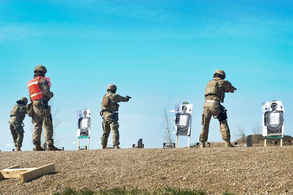 Members of the 91st Security Forces Group Global Strike Challenge fire M9 pistols at Camp Grafton South, Devil’s Lake, N.D., May 4, 2017. The team trained in preparation for the upcoming competition, which challenges security forces tactics, job knowledge and weapons firing. (U.S. Air Force photo/Airman 1st Class Jessica Weissman)