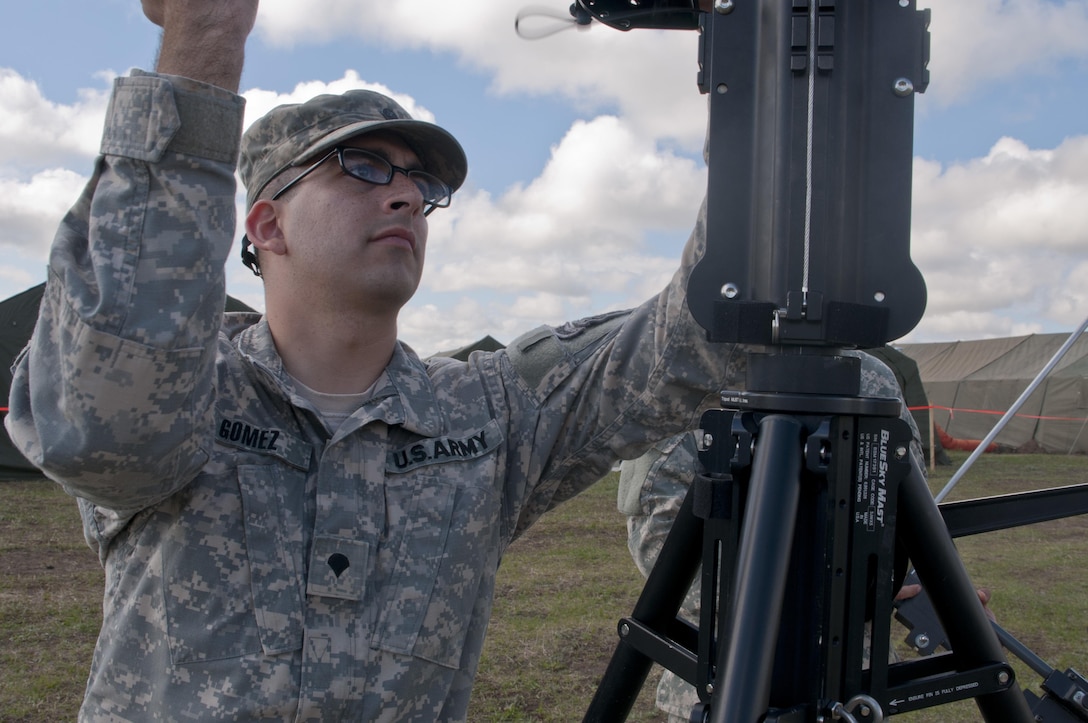 Spc. Cody Gomez, a microwave system operator maintainer for the 306th Psychological Operations Company, assembles a transmission antenna during Exercise Maple Resolve 17 at Camp Wainwright, Alberta, May 16, 2017. Exercise Maple Resolve is an annual collective training event designed for any  contigency operation. Approximately 4,000 Canadian and 1,000 U.S. troops are participating in Exercise Maple Resolve 17.