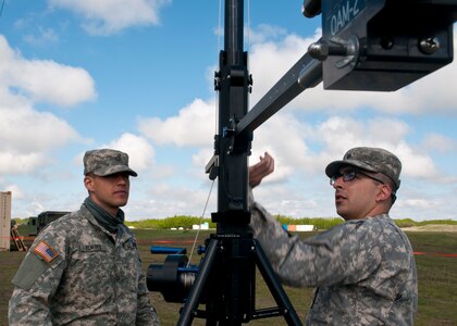 Pfc. Ismael Torres, a cable system installer maintainer, left, and Spc. Cody Gomez, a microwave system operator maintainer, prepare to raise a transmission antenna during Exercise Maple Resolve 17 at Camp Wainwright, Alberta, May 16, 2017. Torres and Gomez, both California natives, belong to the 306th Psychological Operations Company. Exercise Maple Resolve is an annual collective training event designed for any  contigency operation. Approximately 4,000 Canadian and 1,000 U.S. troops are participating in Exercise Maple Resolve 17.