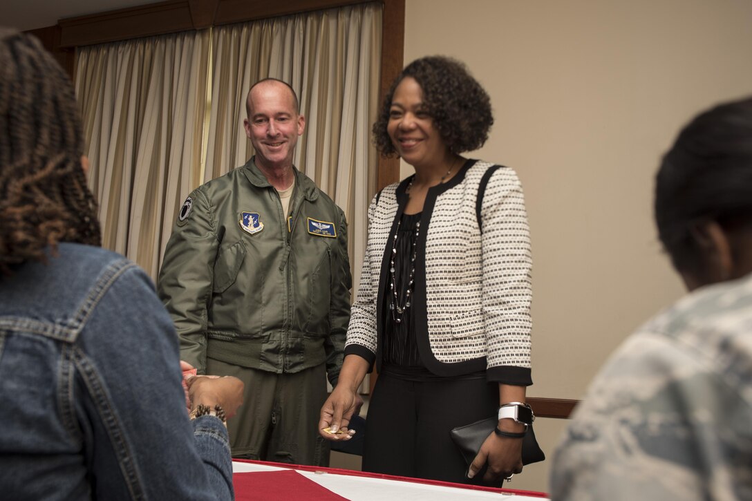 Senior Master Sgt. Jamie Kohr, Air National Guard flight engineer and special missions aviator functional manager, and Vanessa Kohr, his spouse, receive raffle tickets at the beginning of the Military Spouse Appreciation Luncheon inside The Club at Joint Base Andrews, Md., May 12, 2017. This marks the 33rd year of the Military Spouse Appreciation Day as it honors the contributions and sacrifices made by military spouses. (U.S. Air Force photo by Senior Airman Philip Bryant) 