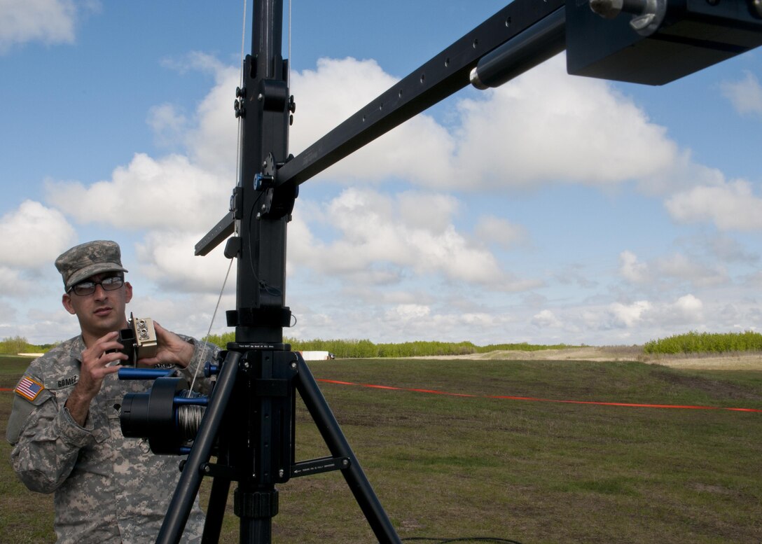 Spc. Cody Gomez, a microwave system operator maintainer for the 306th Psychological Operations Company, assembles a transmission antenna during Exercise Maple Resolve 17 at Camp Wainwright, Alberta, May 16, 2017. Exercise Maple Resolve is an annual collective training event designed for any  contigency operation. Approximately 4,000 Canadian and 1,000 U.S. troops are participating in Exercise Maple Resolve 17.