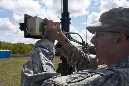 Spc. Cody Gomez, a microwave system operator maintainer for the 306th Psychological Operations Company, assembles a transmission antenna during Exercise Maple Resolve 17 at Camp Wainwright, Alberta, May 16, 2017. Exercise Maple Resolve is an annual collective training event designed for any  contigency operation. Approximately 4,000 Canadian and 1,000 U.S. troops are participating in Exercise Maple Resolve 17.