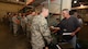 Mark Young, 94th Logistics Readiness Squadron supply and fuels coordinator, issues a mobility bag item to an Airman at Dobbins Air Reserve Base, Georgia. May 5, 2017. Thanks to a new streamlined process for issuing these items, LRS is able to process deployers much faster, said Young. (U.S. Air Force photo/Don Peek)