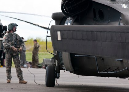 Sgt. Rebecca Himmel, a medic attached to the 1-169th Aviation Regiment, prepares to board a Blackhawk helicopter to perform a joint medevac training mission during Exercise Maple Resolve 17 at Camp Wainwright, Alberta, on May 16, 2017. Exercise Maple Resolve is an annual collective training event designed for any  contigency operation. Approximately 4,000 Canadian and 1,000 U.S. troops are participating in Exercise Maple Resolve 17.