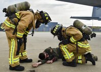 Jarrod Busby and Senior Airman Andrew Javornick, both firefighters with the 910th Civil Engineer Fire Department, inspect injuries on Second Lt. John Pope, a pilot trainee with the 757th Airlift Squadron, who is portraying an accident victim during a Major Accident Response Exercise (MARE), May 16, 2017. Exercise organizers use moulage, cosmetics intended to simulate injuries, to enhance the realism of the scenario. The purpose of the exercise, conducted by the Wing Inspection Team and Emergency Management office, was to document response capabilities of installation personnel while honing joint response practices with local agencies including local law enforcement and the American Red Cross. (U.S. Air Force photo/Eric White)