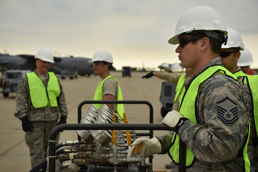 Master Sgt. Anthony Kennedy, a communication and navigation systems craftsman with the 910th Aircraft Maintenance Squadron, operates an air compression manifold to inflate lift bags beneath a C-130H Hercules aircraft during a Major Accident Response Exercise (MARE), May 16, 2017. Kennedy is part of the CDDAR Team, which is trained to respond following an aircraft accident to stabilize and prepare the aircraft for recovery after emergency responders have secured the scene. The lift bags raise the aircraft for further maintenance. The purpose of the exercise, conducted by the Wing Inspection Team and Emergency Management office, was to document response capabilities of installation personnel while honing joint response practices with local agencies including local law enforcement and the American Red Cross. (U.S. Air Force photo/Eric White)
