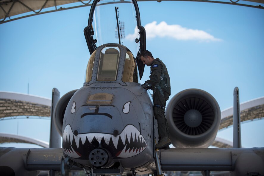 Col. Mark Barrera, 23d Wing vice commander, prepares to enter an A-10C Thunderbolt II to perform his fini flight from Moody Air Force Base, Ga.,  May 15, 2017. Upon completion of their final flights, military aviators are hosed down with water by their comrades, family, and friends before they depart their squadron. Barrera will continue his Air Force career by attending the Joint Military Attaché School to become an Air Attaché in Italy. During this tenure, he will act as an embassy liaison with host-nation defense establishments, openly observe and report developments and significant events, and actively participate in national security and operational policy development and coordination. (U.S. Air Force photo by Airman 1st Class Daniel Snider)