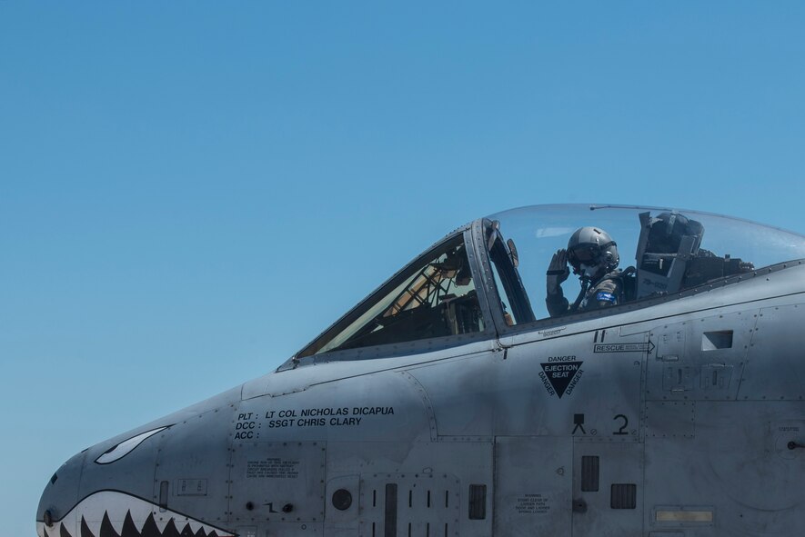 Col. Mark Barrera, 23d Wing vice commander, renders a salute prior to performing his fini flight from Moody Air Force Base, Ga., May 15, 2017. Upon completion of their final flights, military aviators are hosed down with water by their comrades, family, and friends before they depart their squadron. Barrera will continue his Air Force career by attending the Joint Military Attaché School to become an Air Attaché in Italy. During this tenure, he will act as an embassy liaison with host-nation defense establishments, openly observe and report developments and significant events, and actively participate in national security and operational policy development and coordination. (U.S. Air Force photo by Senior Airman Greg Nash) 