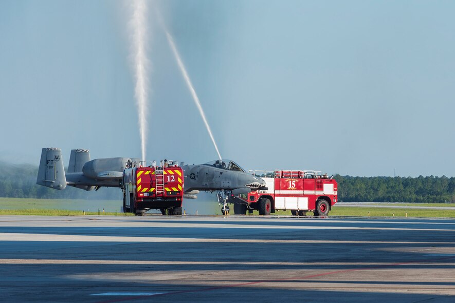 Col. Mark Barrera, 23d Wing vice commander, taxis through a water arch after performing his fini flight from Moody Air Force Base, Ga. May 15, 2017. Upon completion of their final flights, military aviators are hosed down with water by their comrades, family, and friends before they depart their squadron. Barrera will continue his Air Force career by attending the Joint Military Attaché School to become an Air Attaché in Italy. During this tenure, he will act as an embassy liaison with host-nation defense establishments, openly observe and report developments and significant events, and actively participate in national security and operational policy development and coordination. (U.S. Air Force photo by Senior Airman Greg Nash)