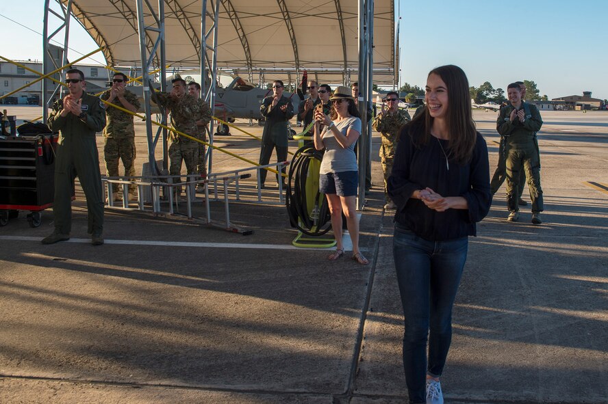 Team Moody members and family of Col. Mark Barrera, 23d Wing vice commander, celebrate the completion of his fini flight from Moody Air Force Base, Ga., May 15, 2017. Upon completion of their final flights, military aviators are hosed down with water by their comrades, family, and friends before they depart their squadron. Barrera will continue his Air Force career by attending the Joint Military Attaché School to become an Air Attaché in Italy. During this tenure, he will act as an embassy liaison with host-nation defense establishments, openly observe and report developments and significant events, and actively participate in national security and operational policy development and coordination. (U.S. Air Force photo by Senior Airman Greg Nash)