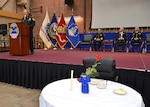 Defense Logistics Agency Installation Support at Richmond Police Officer Sgt. Bradley McCoy highlights the Table of Honor representing officers who died in the line of duty and explained its significance to those gathered for a ceremony honoring fallen law enforcement officers May 11, 2017 in the Frank B. Lotts Conference Center on Defense Supply Center Richmond, Virginia. 