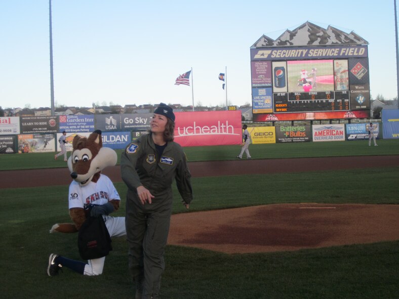 Col. Robyn Slade, 50th Space Wing Senior Individual Mobilization Augmentee to the Commander, throws out the first pitch during the Sky Sox Air Force Night at Security Service Field in Colorado Springs, Colorado, Friday, May 12, 2017.  In addition to Slade, the night featured U.S. Air Force Academy leadership, a dual military family, the High Frontier Honor Guard and Schriever’s own Orbital Harmony.  The Sky Sox Schriever Air Force Base night is set for June 8.  (Courtesy photo)