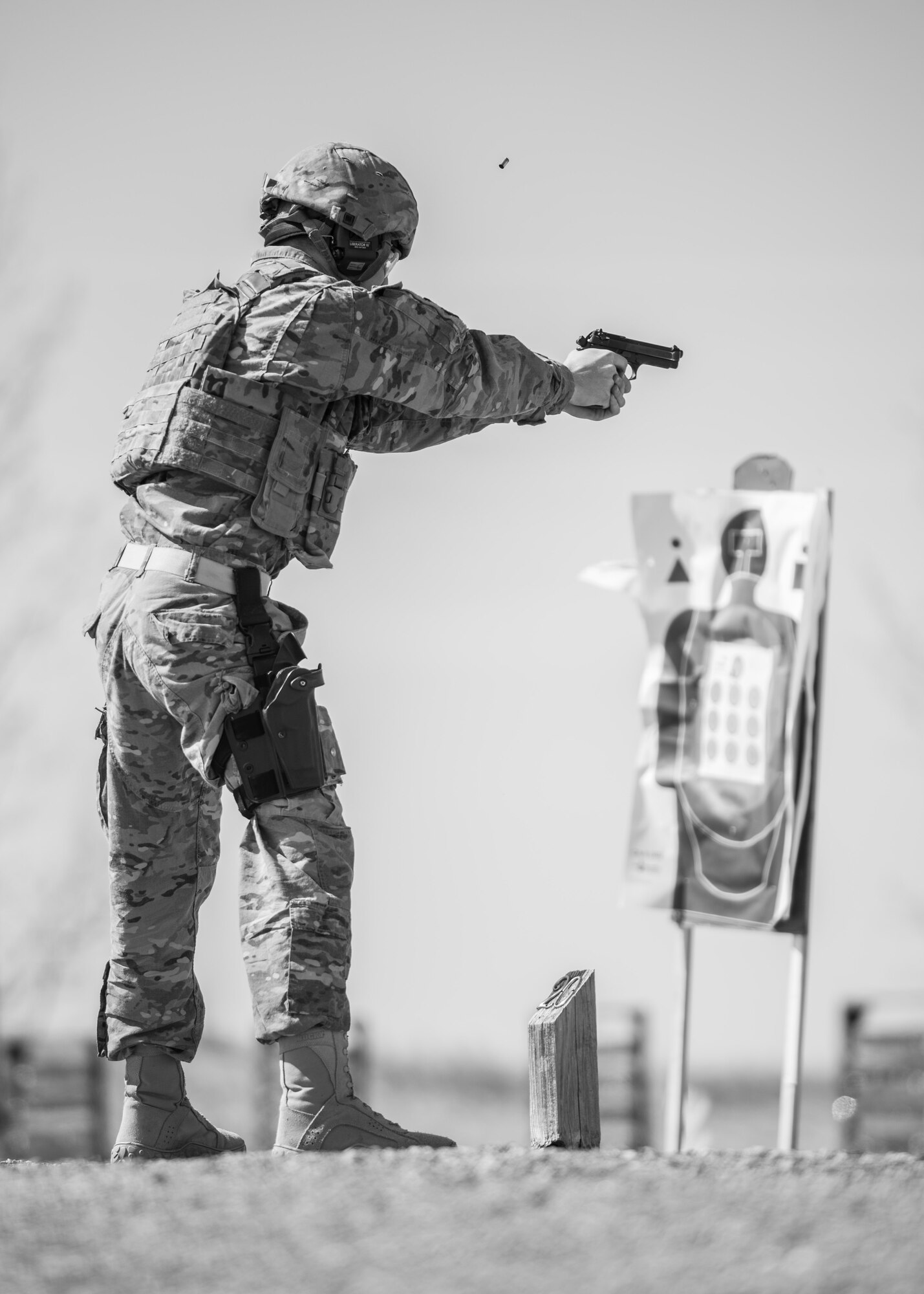 Airman 1st Class Ryan Benjamin, 91st Missile Security Forces Squadron response force member, fires an M9 pistol at Camp Grafton, N.D., May 4, 2017. Defenders combined physical training and weapons firing to prepare for Global Strike Challenge 2017. (U.S. Air Force photo/Senior Airman J.T. Armstrong)