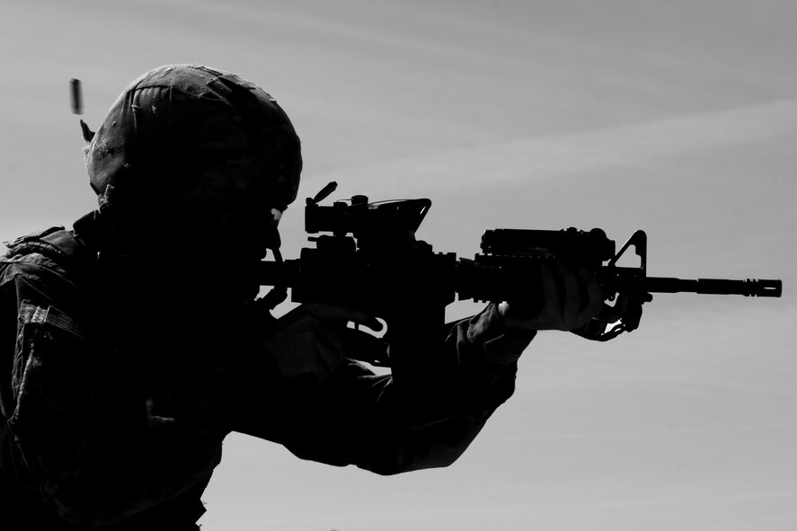 Airman 1st Class Ryan Benjamin, 91st Missile Security Forces Squadron response force member, fires an M4 at Camp Grafton, N.D., May 4, 2017. Defenders combined physical training and weapons firing to prepare for Global Strike Challenge 2017. (U.S. Air Force photo/Senior Airman J.T. Armstrong)