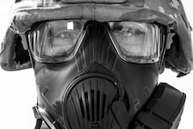 Airman 1st Class Ryan Benjamin, 91st Missile Security Forces Squadron response force member, prepares for Global Strike Challenge training at Camp Grafton, N.D., May 4, 2017. Benjamin, also a 91st SFG Global Strike Challenge team member, used the gas mask to control breathing during the physical training. (U.S. Air Force photo/Senior Airman J.T. Armstrong)