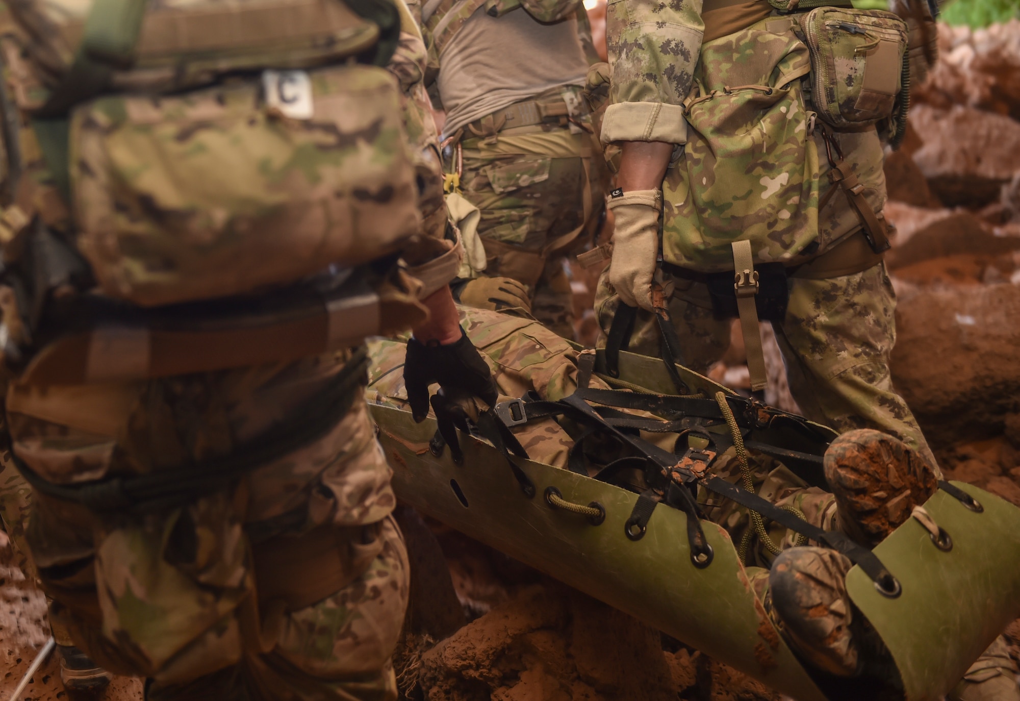 Air Force Special Tactics Airmen with the 24th Special Operations Wing and Italian special operations forces carry a simulated casualty through the Al Biadia Cave Complex during a personnel rescue mission for Eager Lion May 13, 2017, in Mafraq Province, Jordan. Eager Lion 2017, an annual U.S. Central Command exercise in Jordan designed to strengthen military-to-military relationships between the U.S., Jordan and other international partners. This year's iteration is comprised of about 7,200 military personnel from more than 20 nations that will respond to scenarios involving border security, command and control, cyber defense and battlespace management. (U.S. Air Force photo by Senior Airman Ryan Conroy)