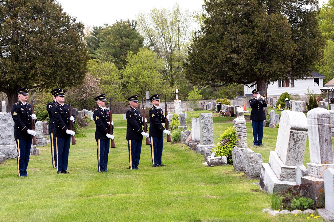 Vermont Army National Guard members render honors during the funeral of Army Cpl. George A. Perreault at Saint Francis Xavier Cemetery, Winooski, Vt., May 13, 2017. The service members are assigned to the Military Funeral Honors Team. Air National Guard photo by Tech. Sgt. Sarah Mattison