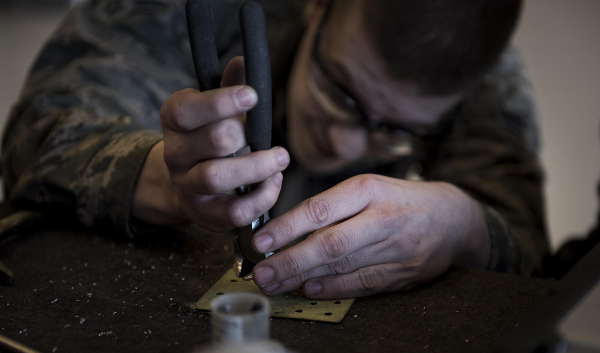 Airman 1st Class Kevin McGeary, 92nd Maintenance Squadron aircraft structural maintenance journeyman, conducts a drain screw nut plate replacement on a non-flush patch May 10, 2017, Fairchild Air Force Base, Wash. Corrosion can occur on a KC-135 Stratotanker if paint gets chipped off in bad weather or if a rock hits an aircraft hard enough to cause damage to the paint exposing the metal. (U.S. Air Force Photo/Airman 1st Class Sean Campbell)
