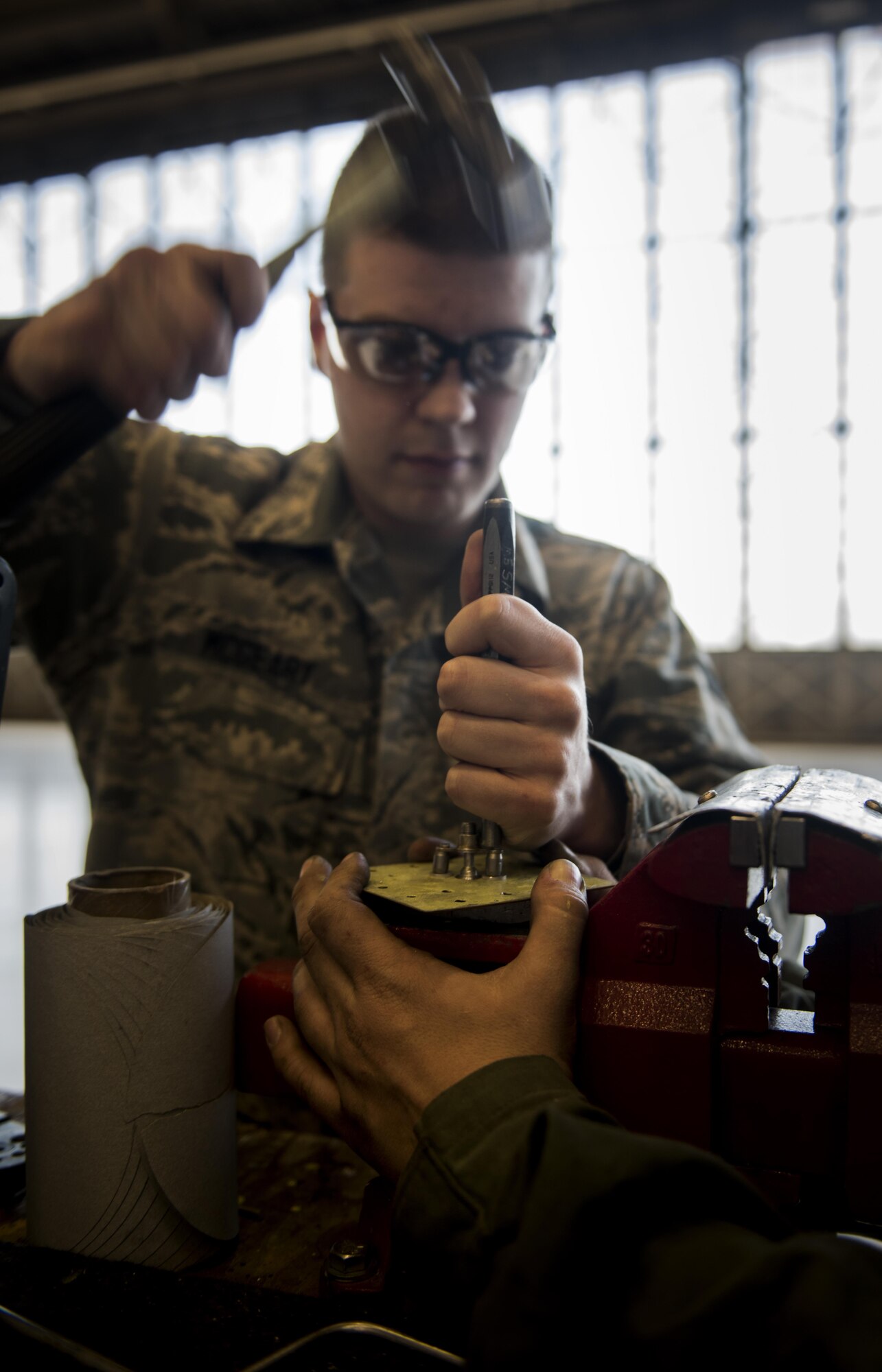 Airman 1st Class Kevin McGeary, 92nd Maintenance Squadron aircraft structural maintenance journeyman, conducts a drain screw nut plate replacement on a non-flush patch May 10, 2017, Fairchild Air Force Base, Wash. A frequent issue the sheet metal shop faces is corrosion. When moisture builds up in different areas of the plane it causes corrosion that damages the plane and when exposed for a long enough period of time causes the metal to crack. (U.S. Air Force Photo/Airman 1st Class Sean Campbell)
