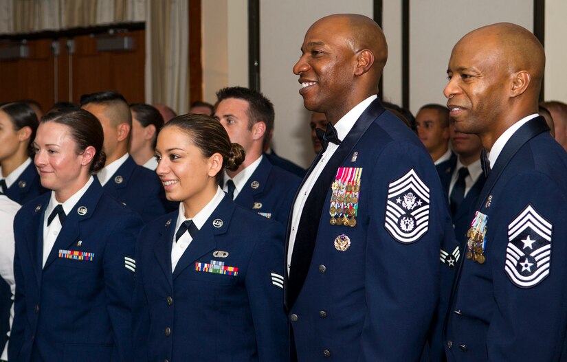 Chief Master Sgt. of the Air Force Kaleth O. Wright poses for a photo with Airmen during an Airman Leadership School graduation at Joint Base Andrews, Md., May 11, 2017. Wright described how supervisors must exemplify the standards of work ethic, character, fitness, and resiliency. (U.S. Air Force photo by Airman 1st Class Gabrielle Spalding)