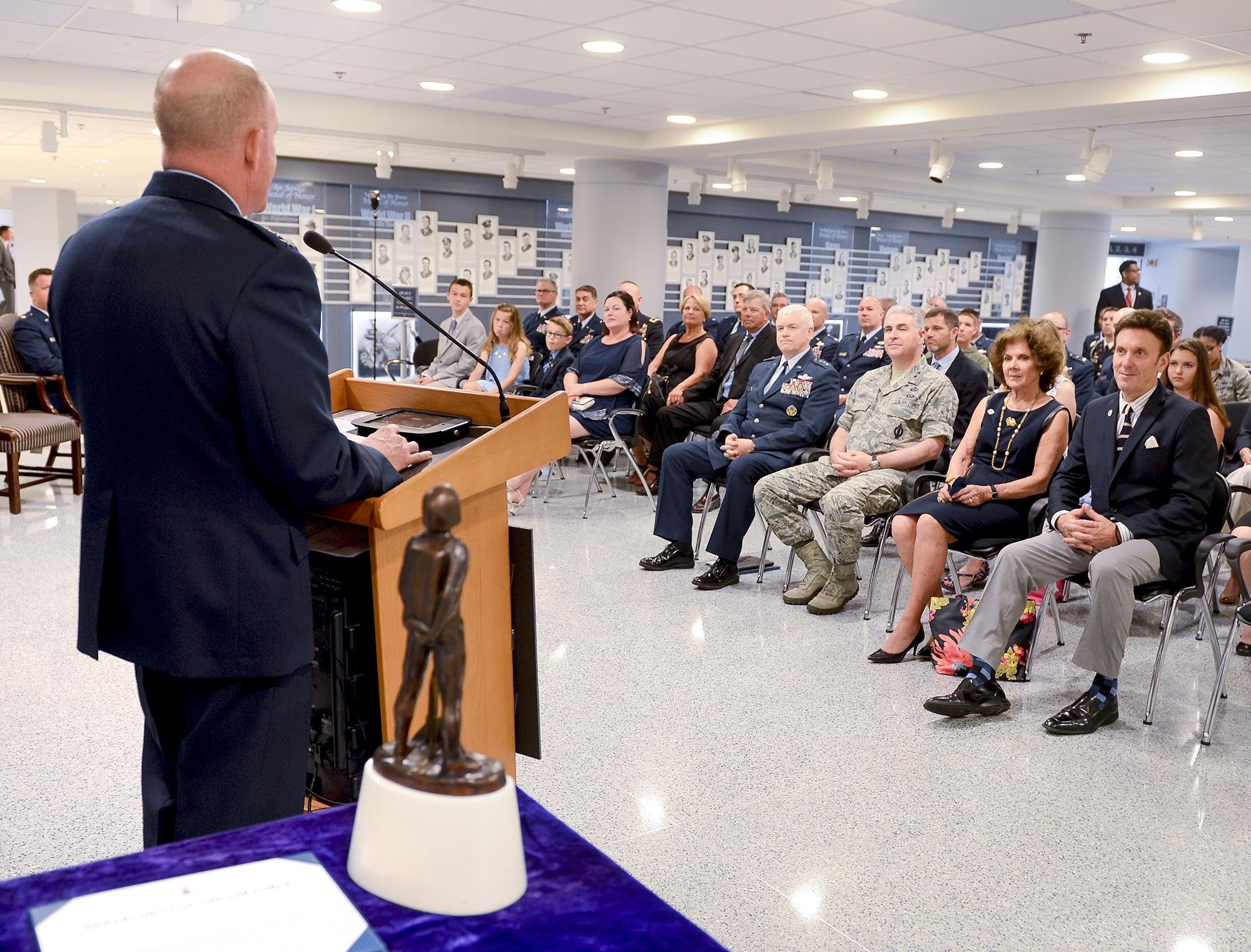 Air Force Vice Chief of Staff Gen. Stephen Wilson talks about the actions taken by Maj. John Hourigan, a 123rd Operations Support Squadron C-130 Hercules pilot,  during the Kolligian Trophy presentation in the Pentagon, Washington, D.C., May 17, 2017. (U.S. Air Force Photo/Andy Morataya)