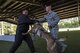 Military working dog Ttoby bites a simulated bite bad guy during a Police Week K-9 demonstration, May 16, 2017, at Moody Air Force Base, Ga. Moody’s Security Forces Squadron and the Valdosta Police Department K-9 unit held a showcase where MWD’s and their civilian counterparts got to show off their skills. Air Force and VPD handler’s explained the differences between commands, training, and procedures and explained how MWD’s are bred and raised. (U.S. Air Force photo Senior Airman Janiqua P. Robinson)