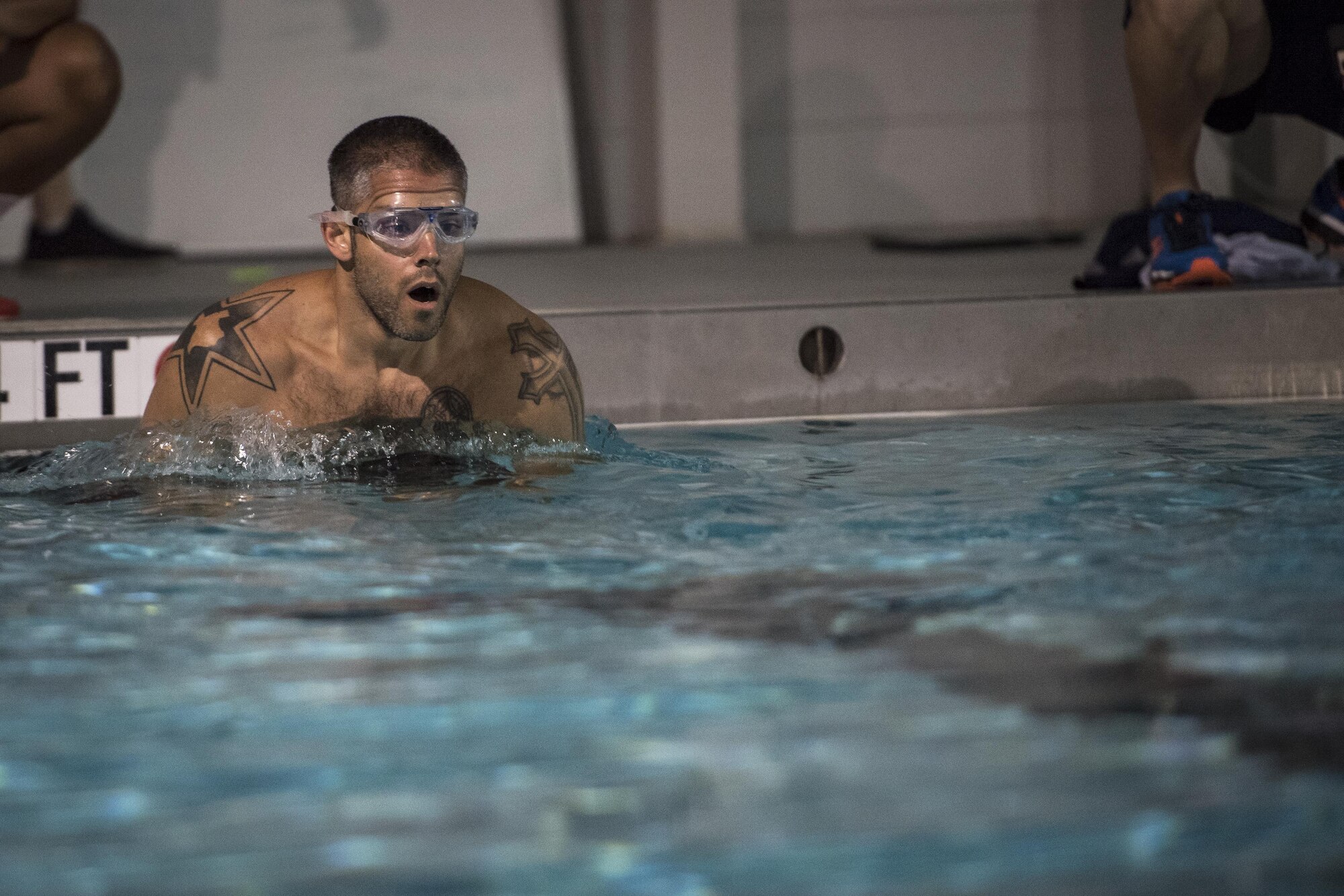 A competitor starts the swim portion of the Police Week Quadathalon, May 15, 2017, at Moody Air Force Base, Ga. Teams of four participated in a swim, run, bike and ruck march competition, where the team with the fastest time won bragging rights. Overall, Police Week is designed to honor the legacies fallen officers, both civilian and military, have left behind, but it also gives various sections within the law enforcement community an opportunity to train together in friendly competitions. (U.S. Air Force photo by Senior Airman Janiqua P. Robinson)