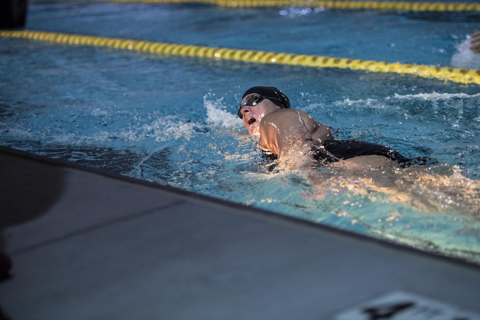 A competitor swims during the Police Week Quadathalon, May 15, 2017, at Moody Air Force Base, Ga. Teams of four participated in a swim, run, bike and ruck march competition, where the team with the fastest time won bragging rights. Overall, Police Week is designed to honor the legacies fallen officers, both civilian and military, have left behind, but it also gives various sections within the law enforcement community an opportunity to train together in friendly competitions. (U.S. Air Force photo by Senior Airman Janiqua P. Robinson)