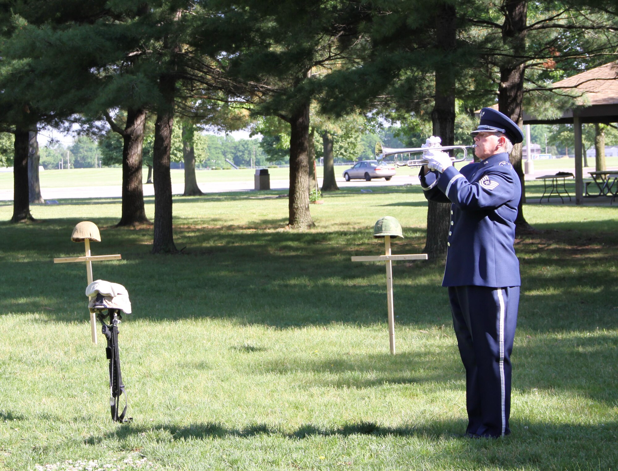 Taps was played May 26, 2016, by bugler Tech. Sgt. Cheryl Przytula, Air Force Band of Flight, during the 2016 Roll Call Memorial Service in the outdoor Memorial Park at the National Museum of the U.S. Air Force, Wright-Patterson Air Force Base. This year’s ceremony falls on May 24 at 9 a.m. and is open to the public. (U.S. Air Force photo/Ted Pitts)