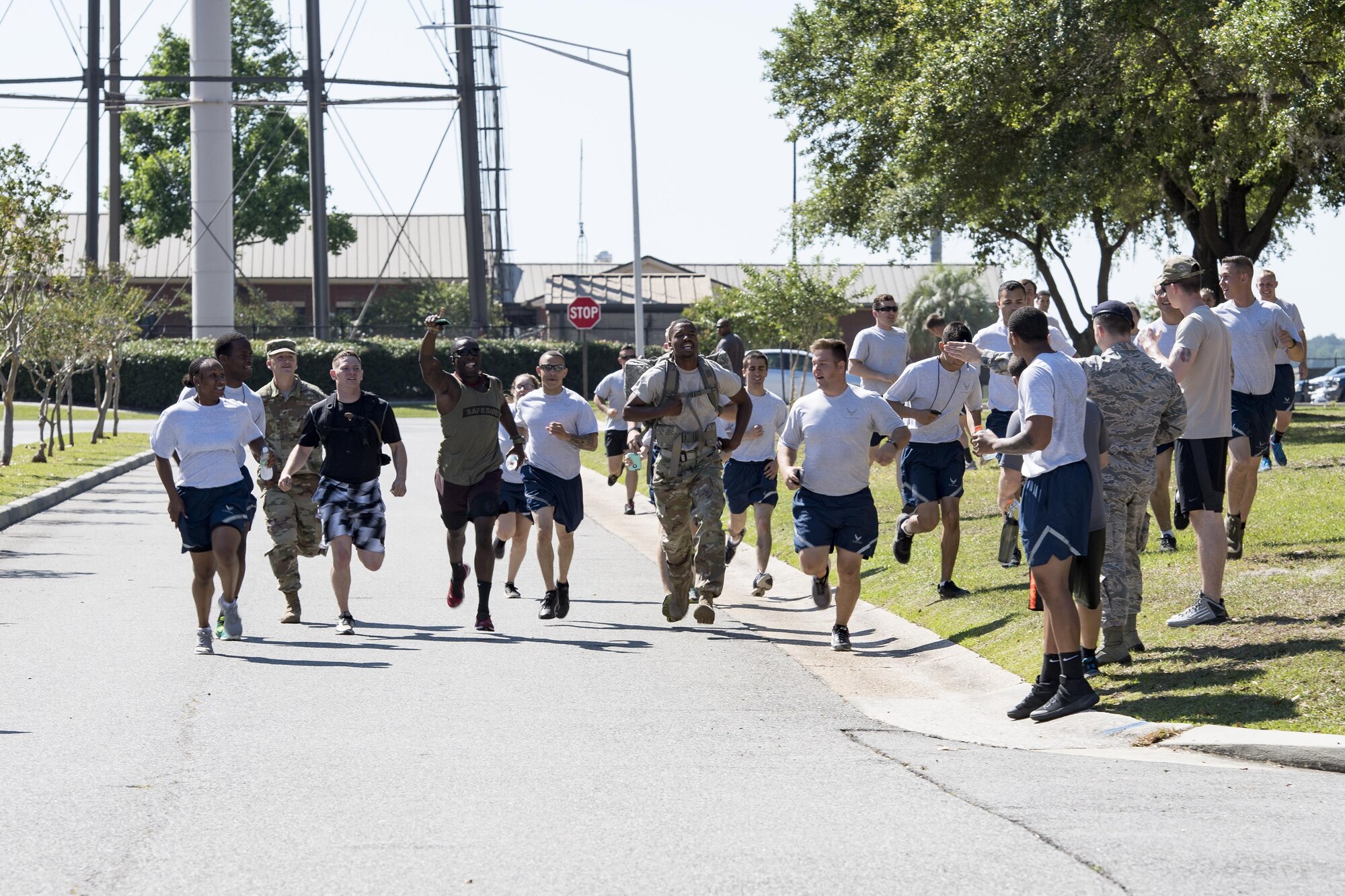 Airman 1st Class David Gardner, 822d Base Defense Squadron fire team member, sprints to the finish line, becoming the first to finish the ruck march portion of the Police Week Quadathalon, May 15, 2017, at Moody Air Force Base, Ga. Teams of four participated in a swim, run, bike and ruck march competition, where the team with the fastest time won bragging rights. Overall, Police Week is designed to honor the legacies fallen officers, both civilian and military, have left behind, but it also gives various sections within the law enforcement community an opportunity to train together in friendly competitions. (U.S. Air Force photo by Senior Airman Janiqua P. Robinson)