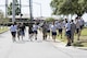 Airman 1st Class David Gardner, 822d Base Defense Squadron fire team member, sprints to the finish line, becoming the first to finish the ruck march portion of the Police Week Quadathalon, May 15, 2017, at Moody Air Force Base, Ga. Teams of four participated in a swim, run, bike and ruck march competition, where the team with the fastest time won bragging rights. Overall, Police Week is designed to honor the legacies fallen officers, both civilian and military, have left behind, but it also gives various sections within the law enforcement community an opportunity to train together in friendly competitions. (U.S. Air Force photo by Senior Airman Janiqua P. Robinson)